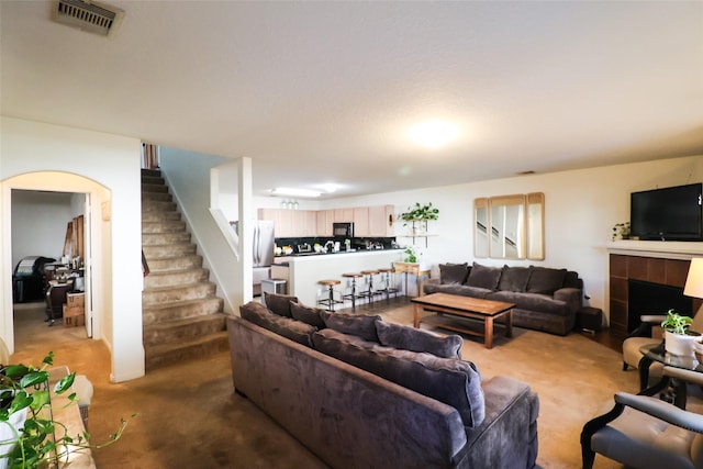 3622 Zephyr Glen Way, Houston, TX 77084 - carpeted living area with stairway and a fireplace