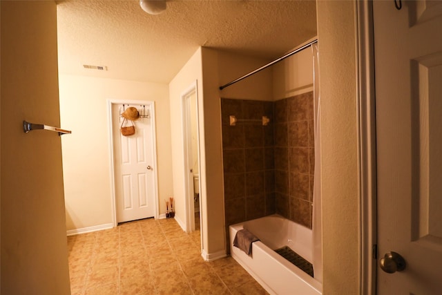 3622 Zephyr Glen Way, Houston, TX 77084 - bathroom with  shower combination, tile patterned flooring, and a textured ceiling