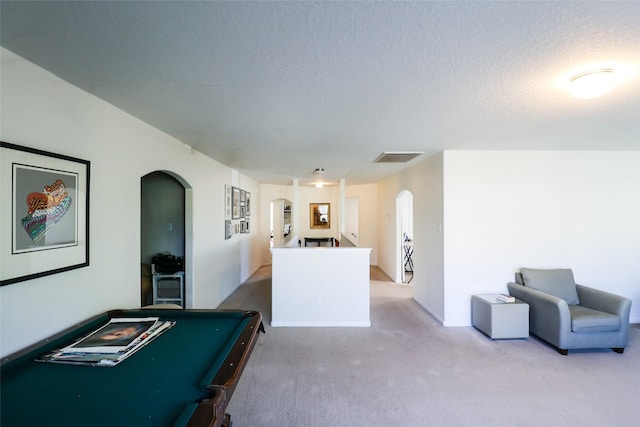 3622 Zephyr Glen Way, Houston, TX 77084 - rec room featuring arched walkways, carpet floors, and a textured ceiling