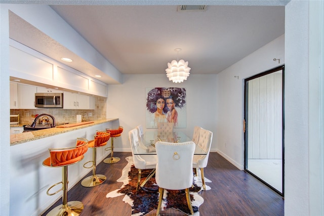 8100 Cambridge St Unit 114, Houston, TX 77054 - dining area with dark wood-style flooring and recessed lighting
