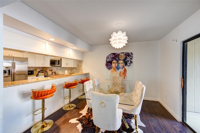 8100 Cambridge St Unit 114, Houston, TX 77054 - dining area featuring dark wood finished floors and recessed lighting