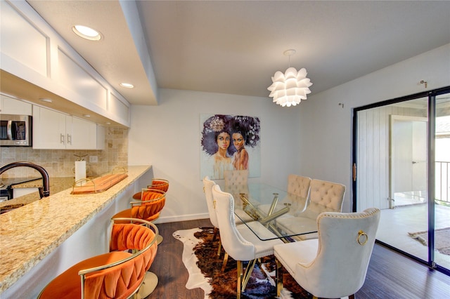 8100 Cambridge St Unit 114, Houston, TX 77054 - dining area featuring dark wood-type flooring and recessed lighting