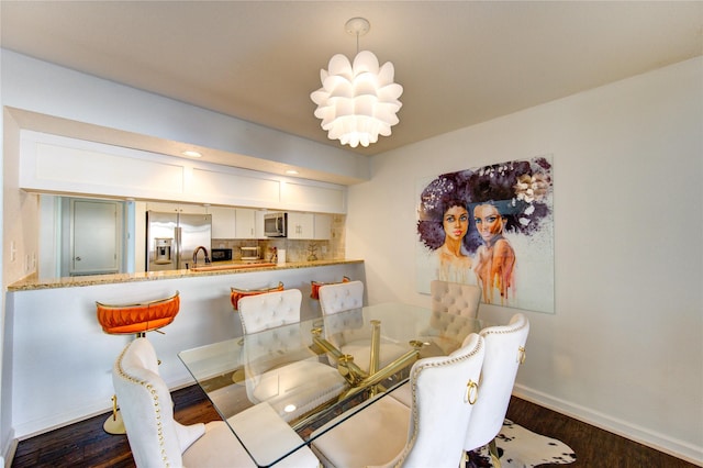 8100 Cambridge St Unit 114, Houston, TX 77054 - dining room with dark wood finished floors and baseboards