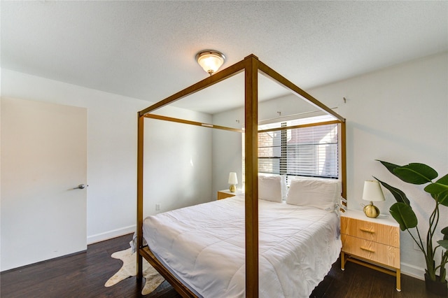 8100 Cambridge St Unit 114, Houston, TX 77054 - bedroom featuring wood finished floors and baseboards