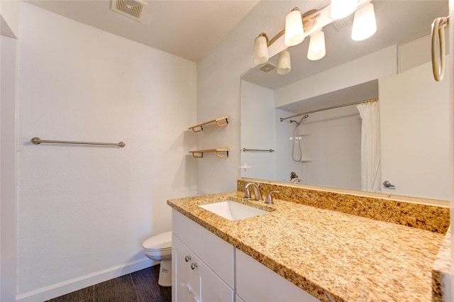 8100 Cambridge St Unit 114, Houston, TX 77054 - full bath with vanity, a shower with shower curtain, and wood finished floors