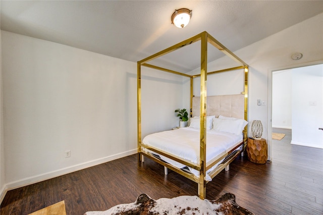8100 Cambridge St Unit 114, Houston, TX 77054 - bedroom featuring wood finished floors and vaulted ceiling