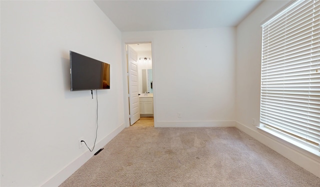 23604 Olive Creek Ln, New Caney, TX 77357 - unfurnished bedroom featuring light colored carpet and connected bathroom