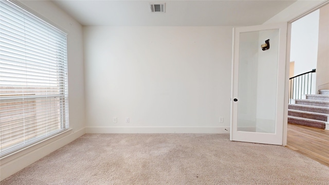23604 Olive Creek Ln, New Caney, TX 77357 - carpeted empty room with stairway and baseboards