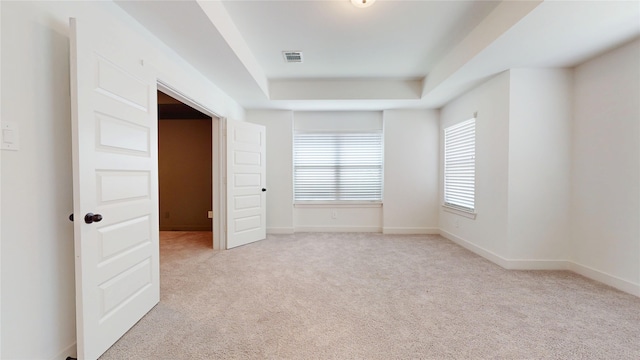23604 Olive Creek Ln, New Caney, TX 77357 - spare room featuring light colored carpet and a tray ceiling