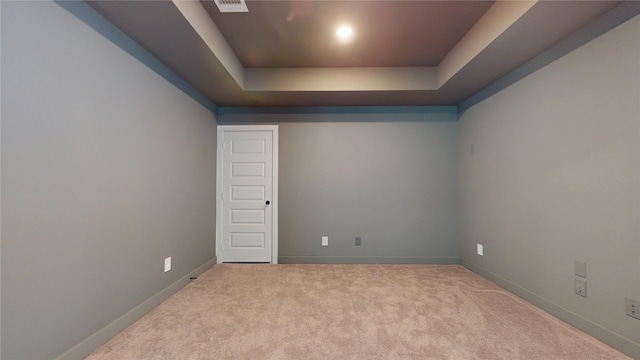 23604 Olive Creek Ln, New Caney, TX 77357 - carpeted empty room featuring a tray ceiling and baseboards