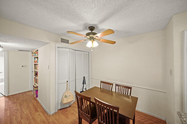 2120 El Paseo St Unit 1403, Houston, TX 77054 - dining room with a textured ceiling, ceiling fan, and light wood-type flooring