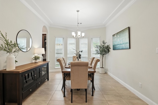 15415 Wildpoint Dr, Cypress, TX 77429 - dining room with light tile patterned floors, a chandelier, ornamental molding, and arched walkways