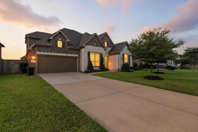 15415 Wildpoint Dr, Cypress, TX 77429 - view of front facade with brick siding, concrete driveway, a garage, and stone siding