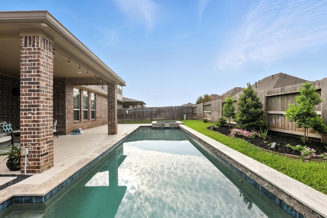 15415 Wildpoint Dr, Cypress, TX 77429 - view of swimming pool with a patio, a fenced backyard, and a pool with connected hot tub