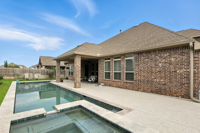 15415 Wildpoint Dr, Cypress, TX 77429 - view of pool with a patio area, a fenced backyard, and a pool with connected hot tub