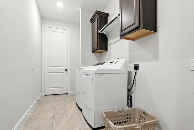 15415 Wildpoint Dr, Cypress, TX 77429 - washroom with independent washer and dryer, cabinet space, light tile patterned floors, and recessed lighting
