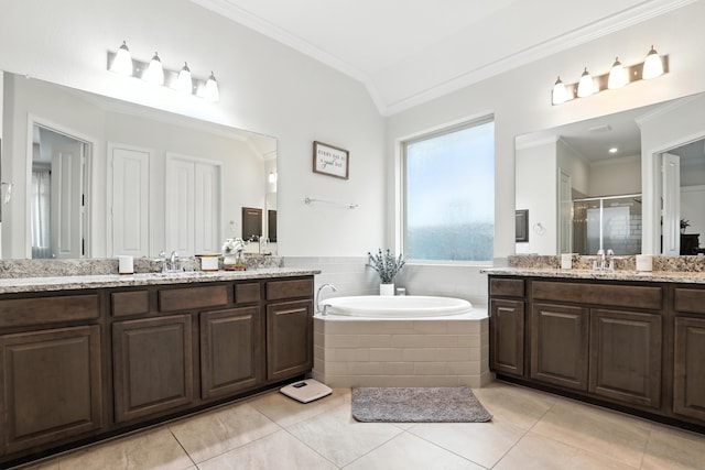 15415 Wildpoint Dr, Cypress, TX 77429 - bathroom with ornamental molding, two vanities, a stall shower, a garden tub, and tile patterned floors