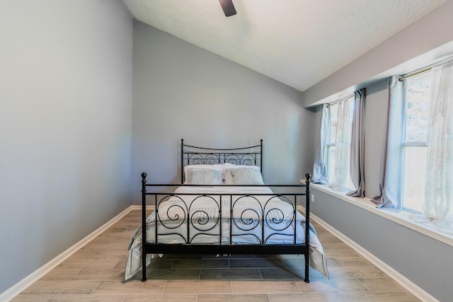 4218 E Terrace Creek Cir, Houston, TX 77014 - bedroom featuring vaulted ceiling, wood finish floors, and ceiling fan
