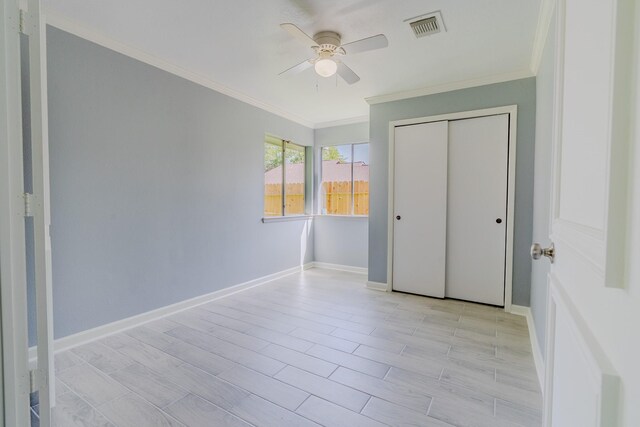 4218 E Terrace Creek Cir, Houston, TX 77014 - unfurnished bedroom featuring ornamental molding, a closet, and a ceiling fan