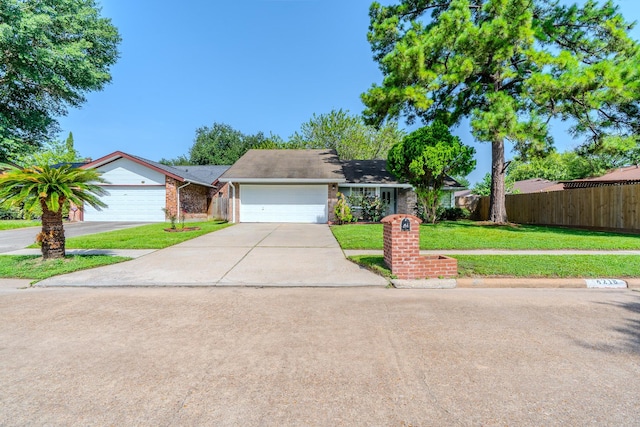 4218 E Terrace Creek Cir, Houston, TX 77014 - view of front of house with driveway, brick siding, and a garage