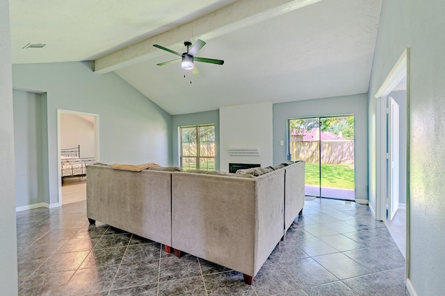 4218 E Terrace Creek Cir, Houston, TX 77014 - living area featuring a ceiling fan, dark tile patterned flooring, and a fireplace