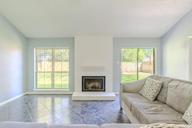 4218 E Terrace Creek Cir, Houston, TX 77014 - tiled living area featuring baseboards and a large fireplace