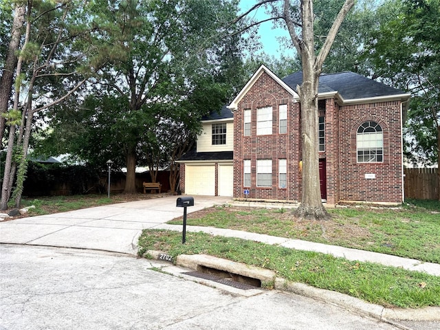 2702 Dovewood Ln, Spring, TX 77373 - traditional-style house with brick siding, a garage, driveway, and a shingled roof