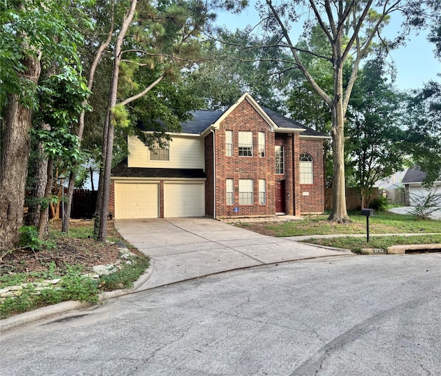 2702 Dovewood Ln, Spring, TX 77373 - traditional-style home featuring brick siding, a garage, and driveway
