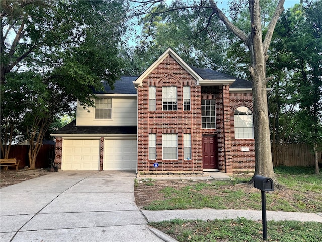 2702 Dovewood Ln, Spring, TX 77373 - traditional-style house featuring brick siding, driveway, and a garage