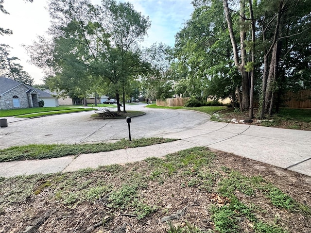 2702 Dovewood Ln, Spring, TX 77373 - view of concrete road featuring sidewalks