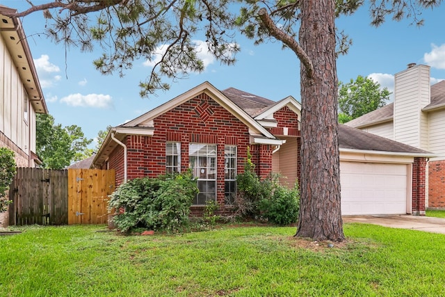 17006 Dusty Mill Dr E, Sugar Land, TX 77498 - traditional home with brick siding, a garage, driveway, and a gate