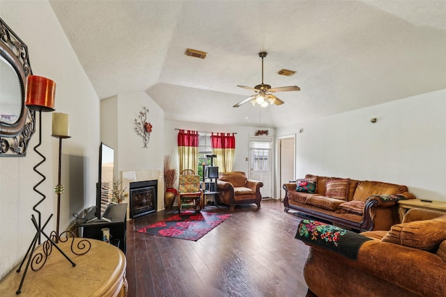 17006 Dusty Mill Dr E, Sugar Land, TX 77498 - living room with hardwood / wood-style floors, a fireplace, ceiling fan, a textured ceiling, and lofted ceiling