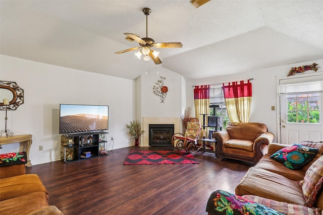 17006 Dusty Mill Dr E, Sugar Land, TX 77498 - living room with vaulted ceiling, plenty of natural light, wood finished floors, ceiling fan, and a fireplace