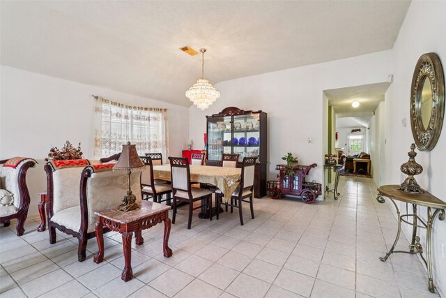 17006 Dusty Mill Dr E, Sugar Land, TX 77498 - dining space with a chandelier and light tile patterned flooring