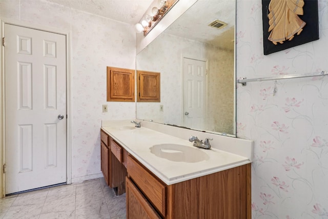 17006 Dusty Mill Dr E, Sugar Land, TX 77498 - bathroom with wallpapered walls and double vanity