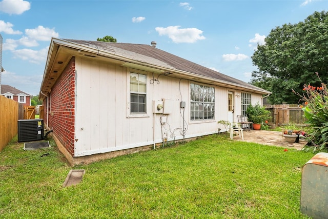 17006 Dusty Mill Dr E, Sugar Land, TX 77498 - rear view of house with a patio area, a fenced backyard, and roof with shingles