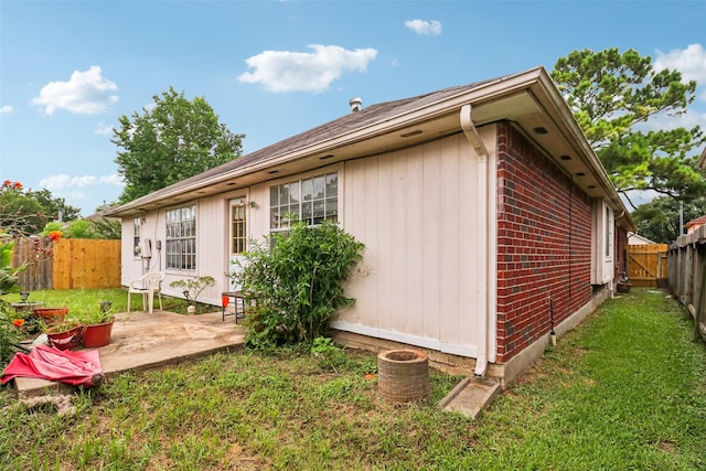 17006 Dusty Mill Dr E, Sugar Land, TX 77498 - view of side of property with a fenced backyard, a patio area, and brick siding