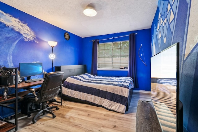 17006 Dusty Mill Dr E, Sugar Land, TX 77498 - bedroom with a textured ceiling, wood finished floors, and an office area