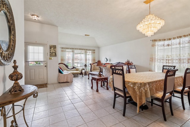17006 Dusty Mill Dr E, Sugar Land, TX 77498 - dining space featuring a chandelier, light tile patterned floors, and lofted ceiling