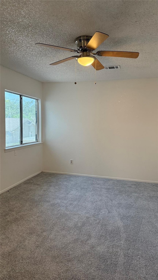 12922 Wirevine Ln, Houston, TX 77072 - spare room with carpet flooring, a ceiling fan, and a textured ceiling