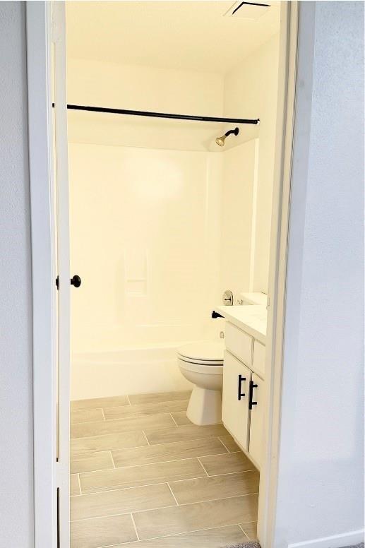 12922 Wirevine Ln, Houston, TX 77072 - bathroom with vanity, washtub / shower combination, and wood tiled floors