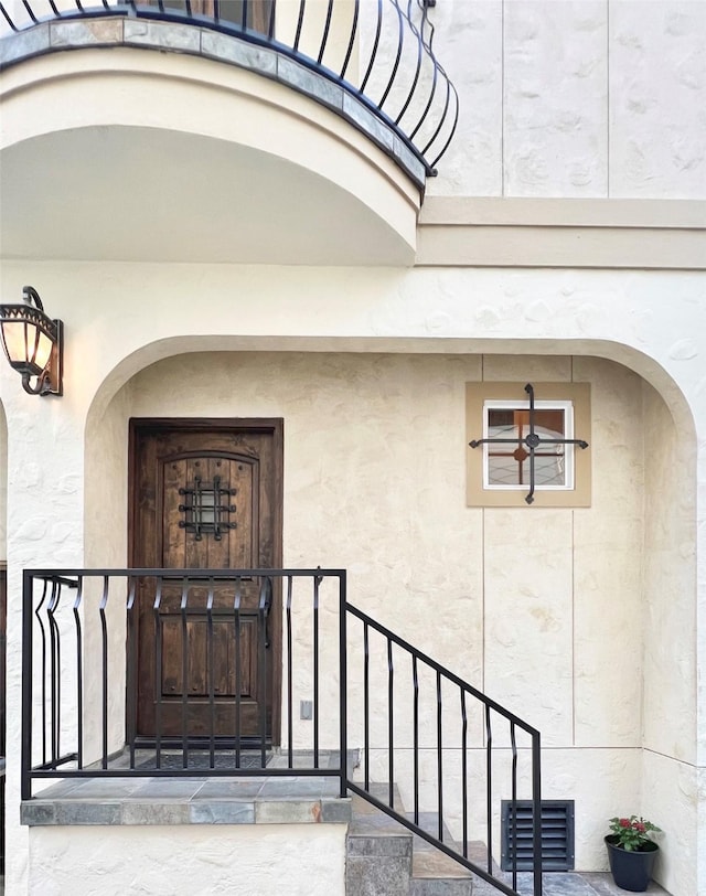 1241 W 24th St Unit C, Houston, TX 77008 - doorway to property with stucco siding