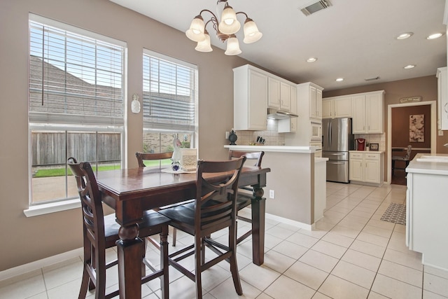 12103 Via San Rocco Ct, Cypress, TX 77429 - dining room with light tile patterned flooring, a chandelier, and recessed lighting
