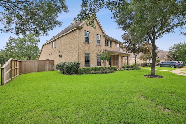 12103 Via San Rocco Ct, Cypress, TX 77429 - view of property exterior with brick siding and a chimney