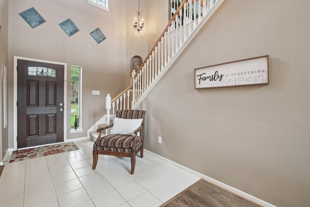 12103 Via San Rocco Ct, Cypress, TX 77429 - foyer with stairway, healthy amount of natural light, a chandelier, a towering ceiling, and tile patterned flooring