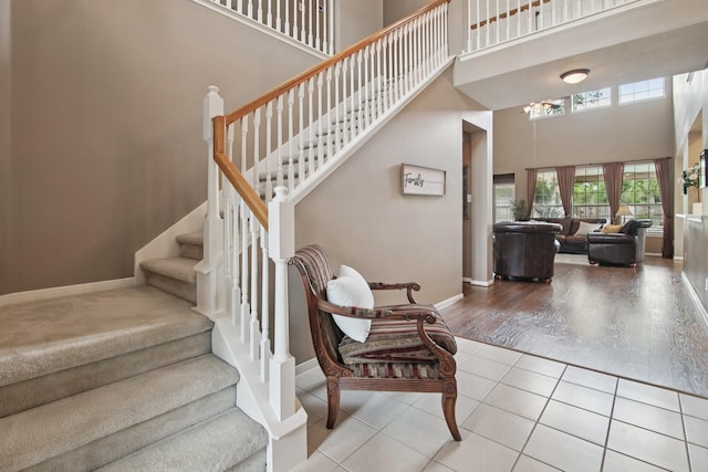 12103 Via San Rocco Ct, Cypress, TX 77429 - staircase featuring a high ceiling and tile patterned flooring