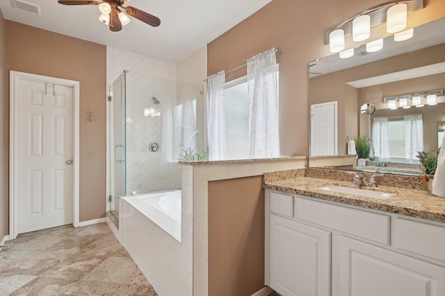 12103 Via San Rocco Ct, Cypress, TX 77429 - bathroom featuring healthy amount of natural light, a stall shower, a ceiling fan, and vanity