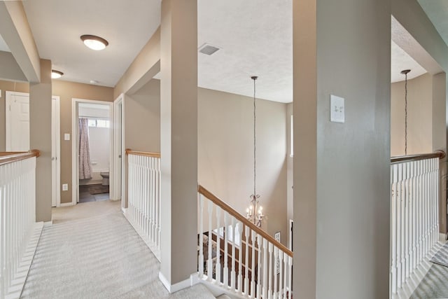 12103 Via San Rocco Ct, Cypress, TX 77429 - hallway with a chandelier, an upstairs landing, and carpet