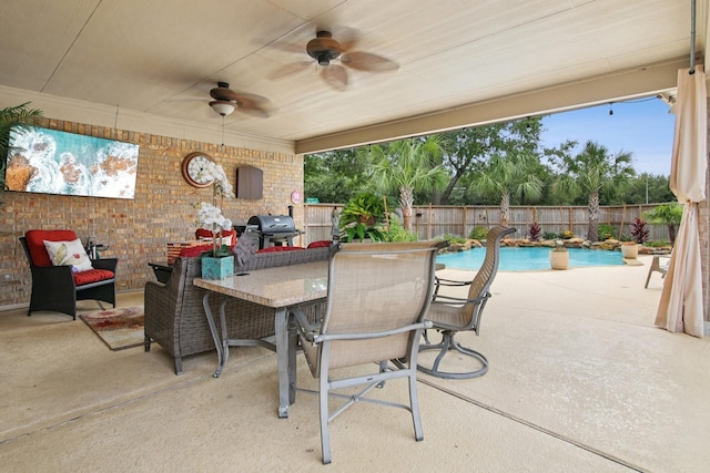 12103 Via San Rocco Ct, Cypress, TX 77429 - fenced backyard featuring a grill, a patio, ceiling fan, and outdoor dining area