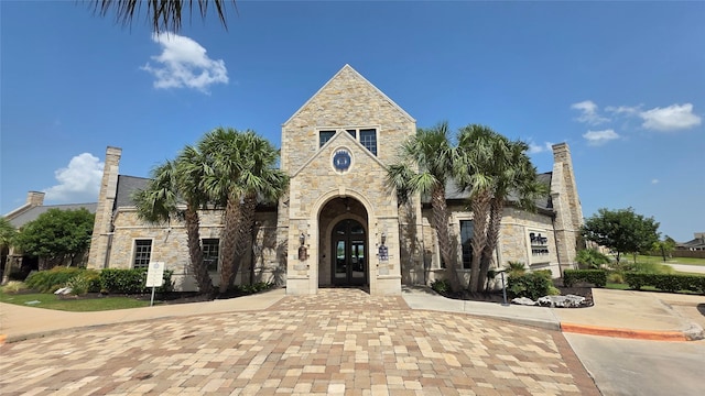 12831 Raemoir Dr, Humble, TX 77346 - view of front of home featuring stone siding and french doors